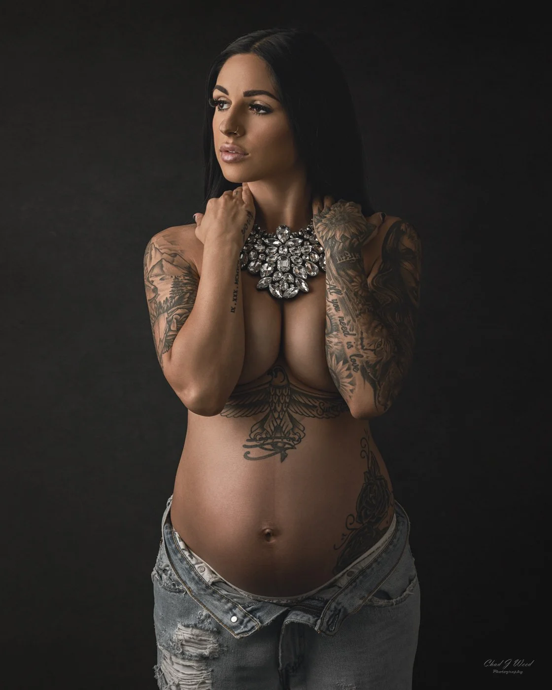 Maternity Photoshoot in Jeans: Maternity shoot with mom in ripped jeans in soft window light