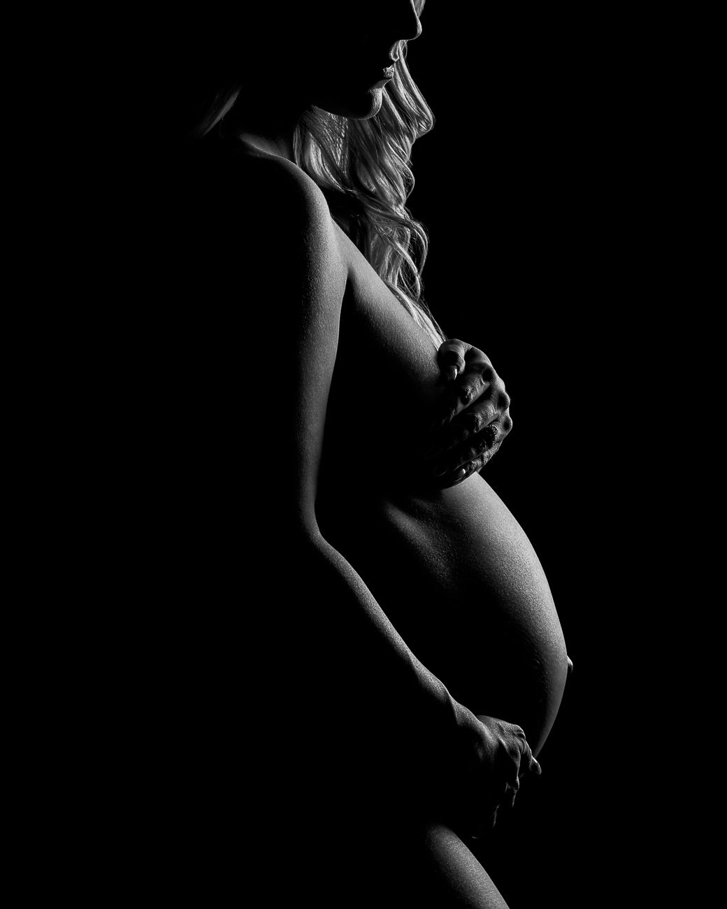 Phoenix maternity photographer fine-art silhouette on black background