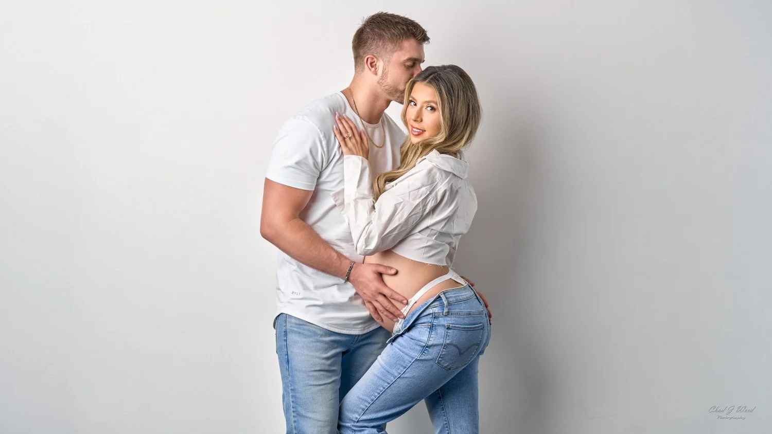 Intimate maternity photo of couple embracing