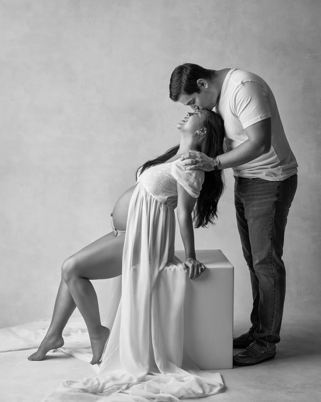 Studio maternity couples photography with soft lighting