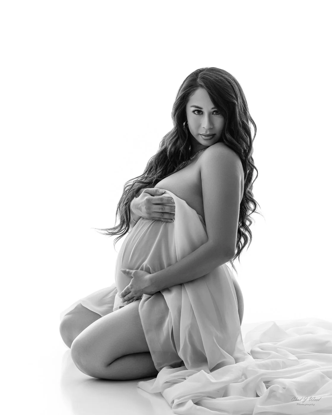 Phoenix maternity photography with intimate pregnant woman in artistic fabric wrap