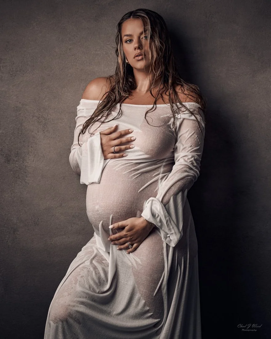 Wet Maternity Shoot: Wet hair and fabric clinging to expectant mother's figure