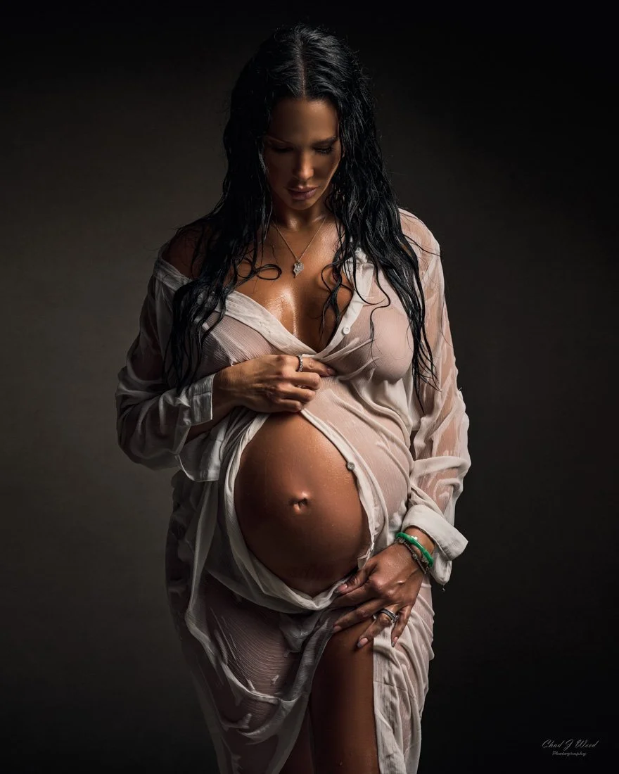 Intimate Maternity Photography: Pregnant woman wet look with a white shirt