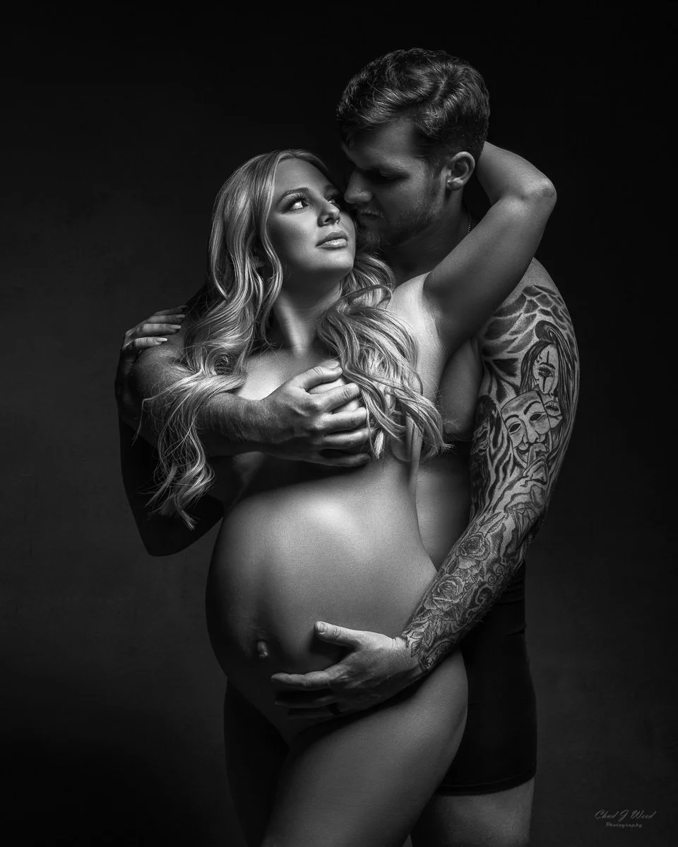 Dramatic Fine art maternity photoshoot of expectant couple embracing