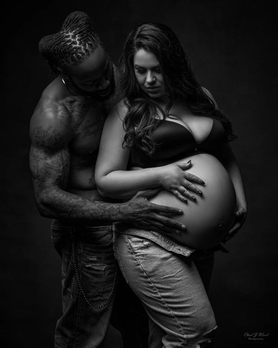 Maternity couples intimate side profile pose with arms around belly