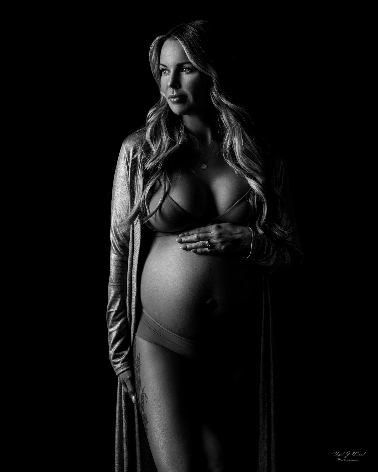 Black and white maternity silhouette portrait taken by photographer Chad J Weed