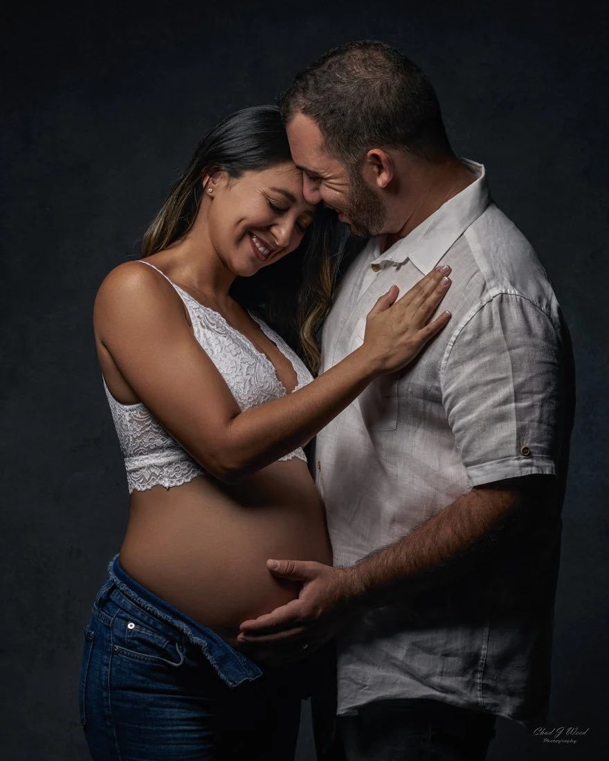 Couple in jeans during maternity photo session