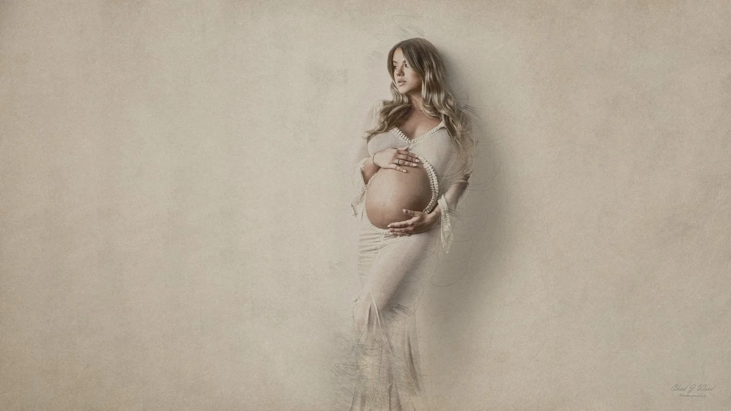 Phoenix Fine Art Pregnancy Photographer: Pregnant woman in a lace gown, standing against a wall