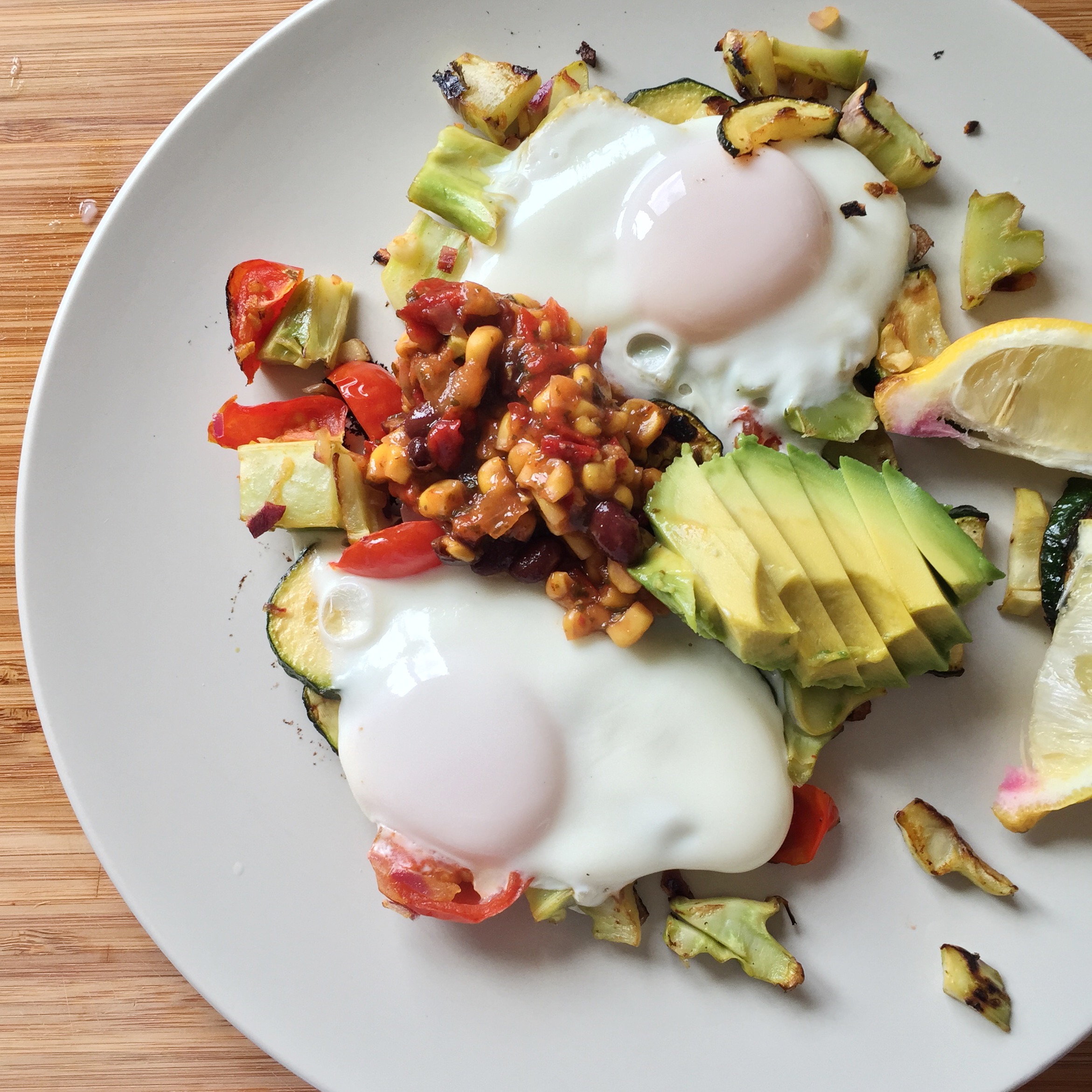 Breakfast scramble using my tomatoes, broccoli stems, zucchini, & avocado, and some local eggs
