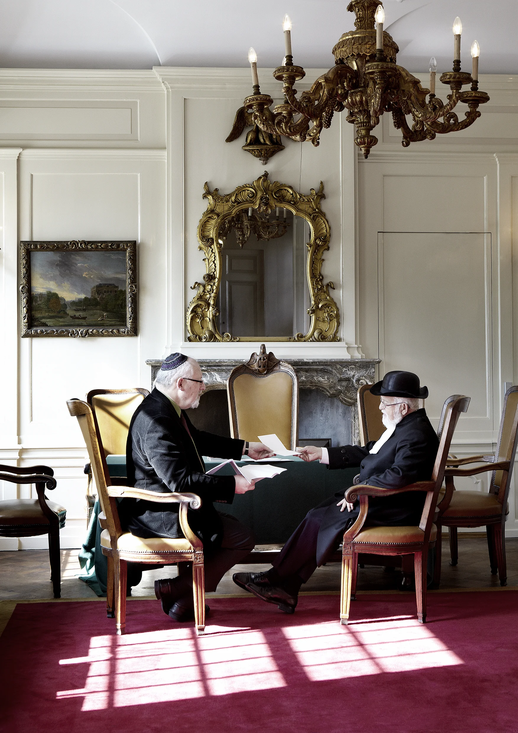 Secretary Natan Mokhed handing Chief Rabbi Toledano a letter