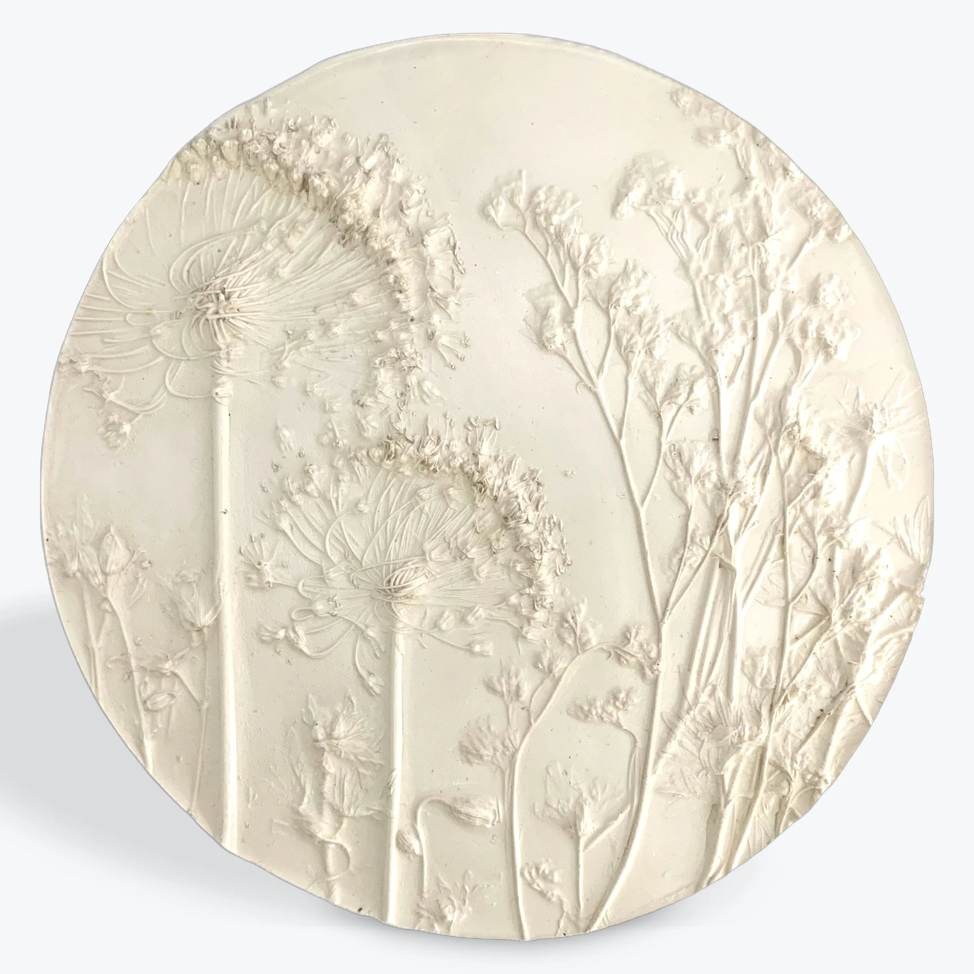  Wildflowers in White, milk-paint on hydrostone, 10in round x 0.5in deep (ready to hang with picture-wire hook on back)   The enchantment of these beautiful wildflowers are forever captured in this botanical cast. Let the magic live on and on in your