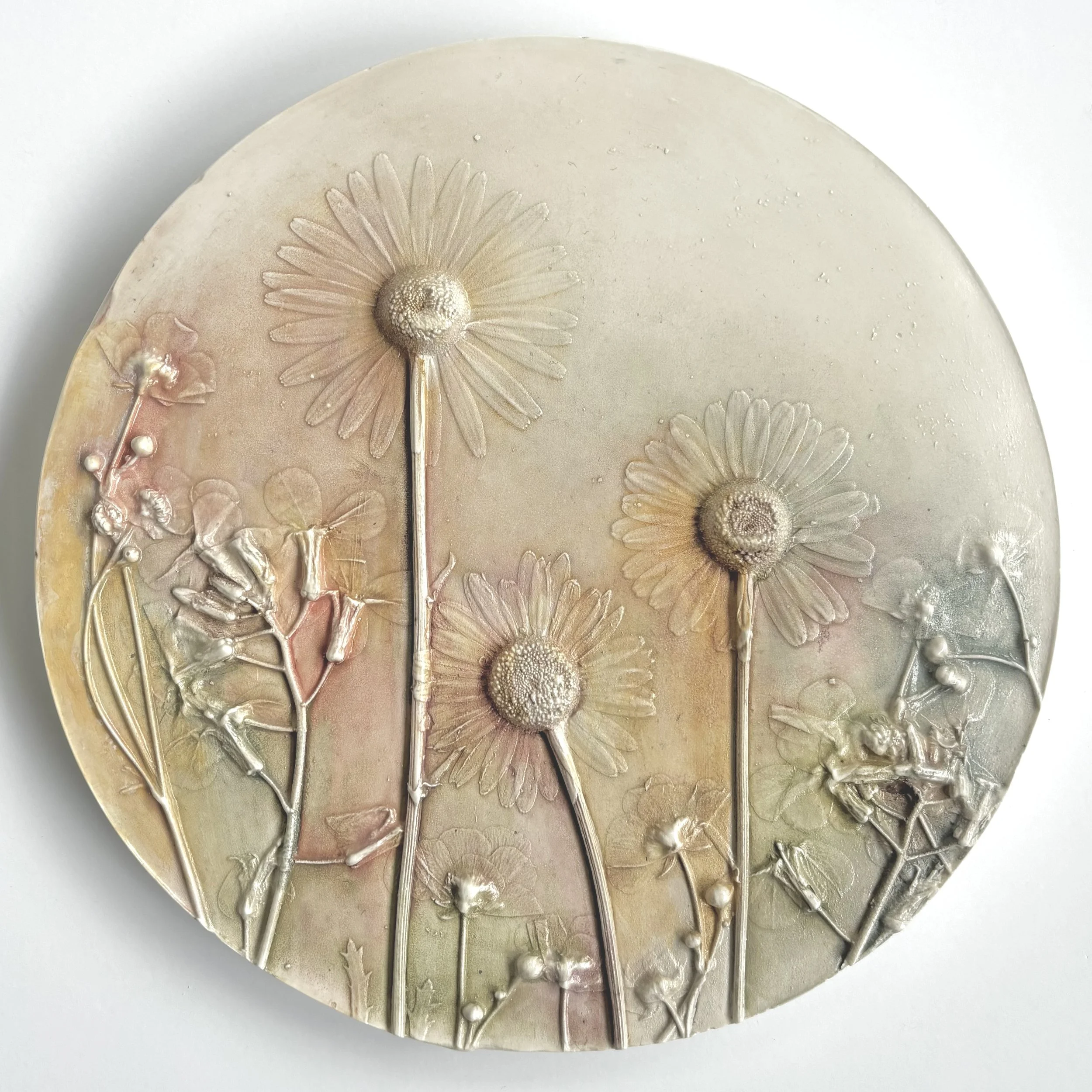  Zephyrs of Summer No. 2, milk-paint on hydrostone, 7.6in round x 0.6in (ready to hang with picture-wire hook on back)   “Zephyrs of Summer” embodies the essence of a warm breeze with soft pastel colours, creating a serene landscape bathed in golden 