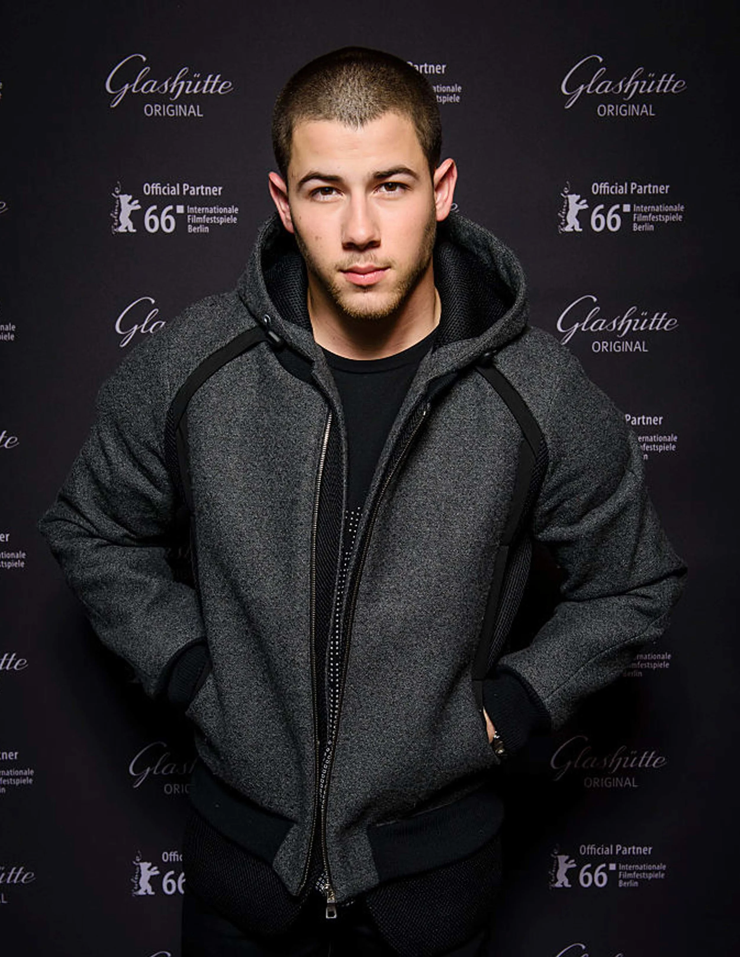 Nick Jonas @ Berlin Film Festival / Feb 18, 2016. Wearing - wool sleeveless blazer, wool bommer jacket and sweatshirt.