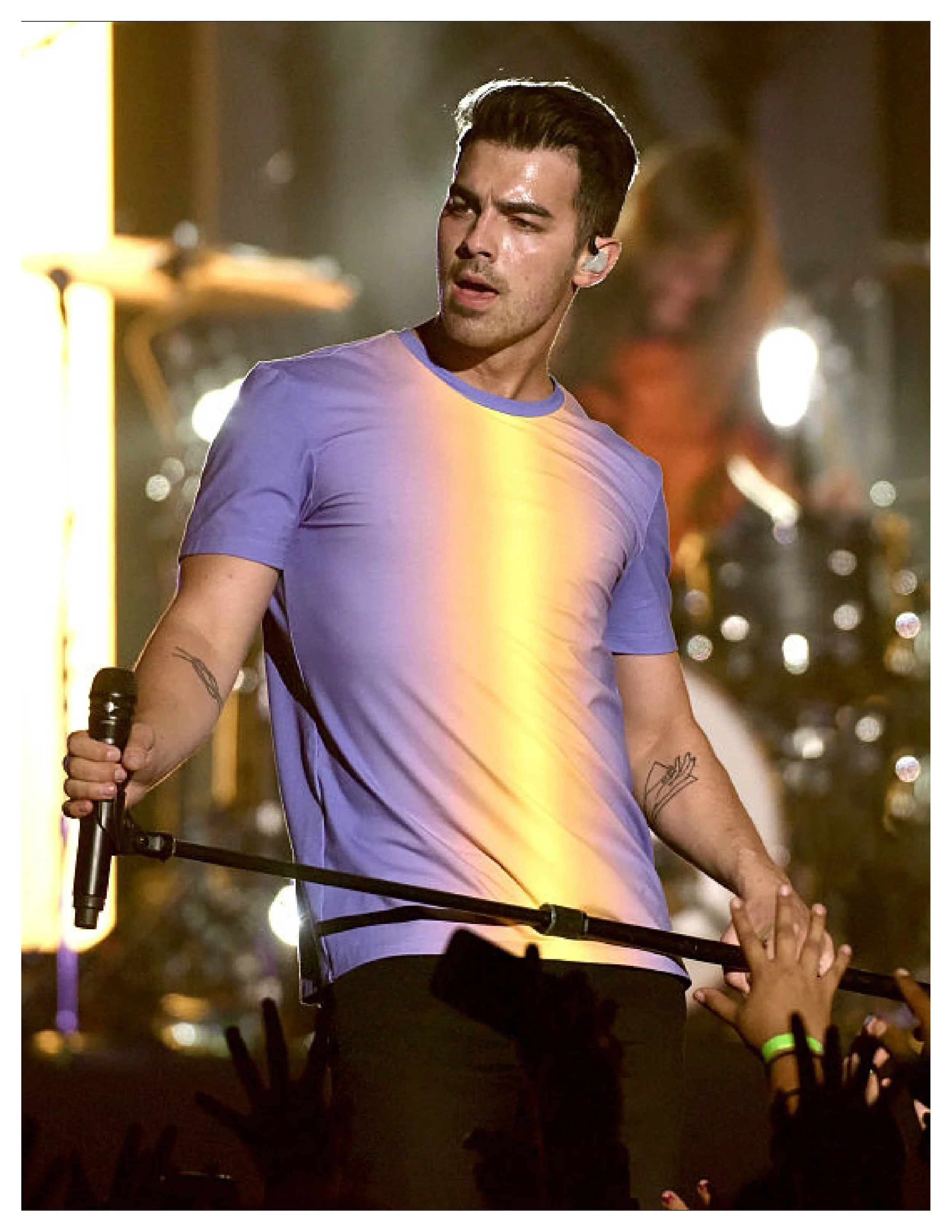 Joe Jonas Kick's off his TOUR wearing GARCIAVELEZ Light reveal Tee.