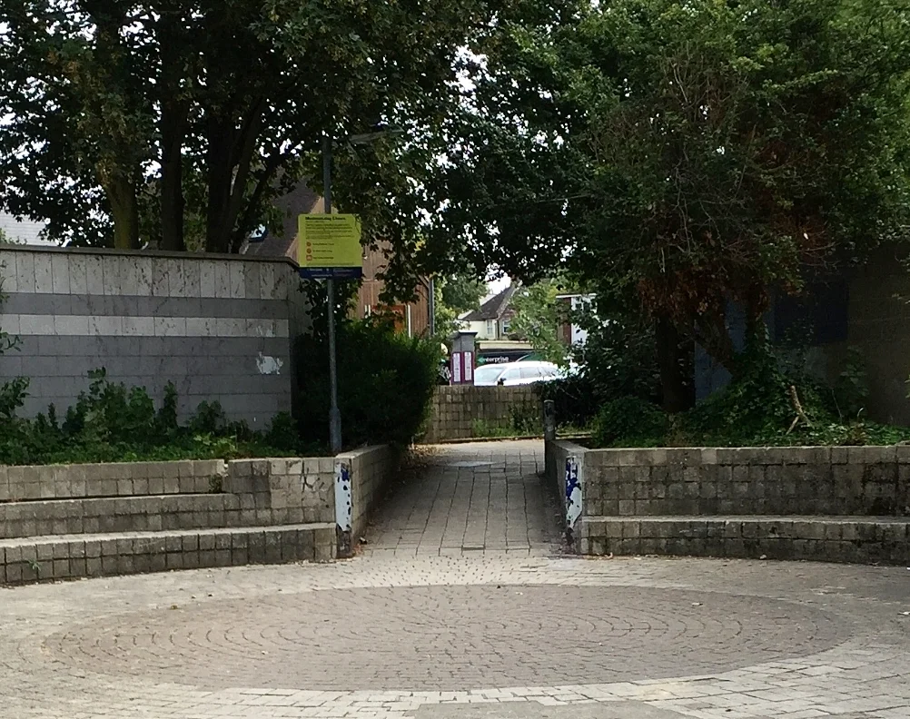 When you find the seating area, keep walking across the middle.