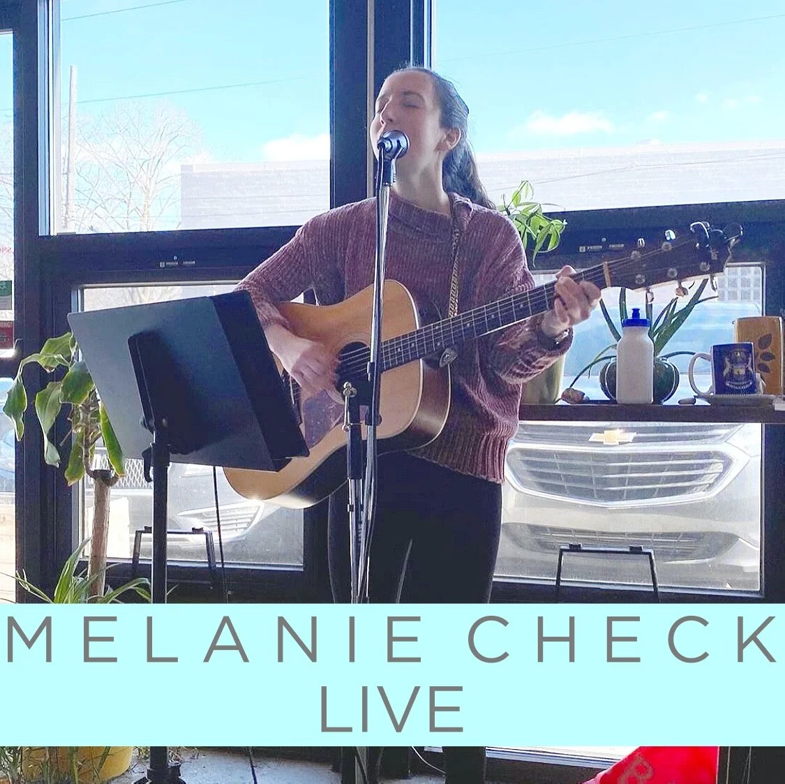 MELANIE CHECK LIVE.jpg