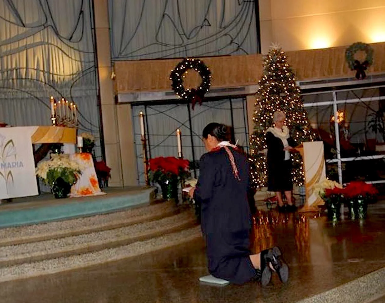 During the Mass, Sr Georgeanne Marie Donovan, congregational leader (right) listens as Sr Senitila recites her vows to live forever her consecration to God in poverty, chastity and obedience, according to the Constitutions of the Missionary Sisters of the Society of Mary.