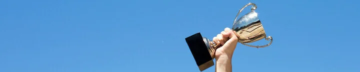 hand-holding-trophy to use.jpg