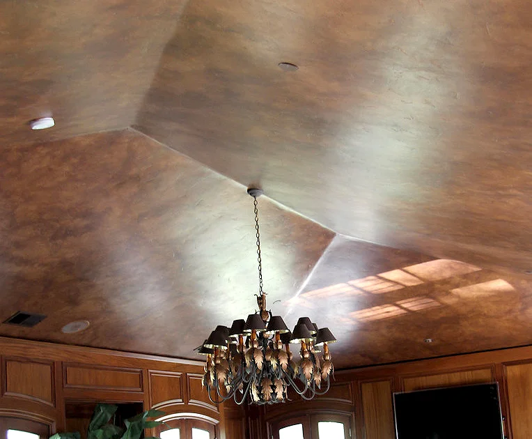 Distressed and aged leather treatment to library ceiling