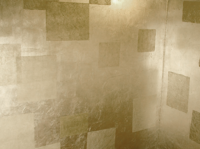 Genuine silver leaf powder room walls with waxed stenciled square overlay