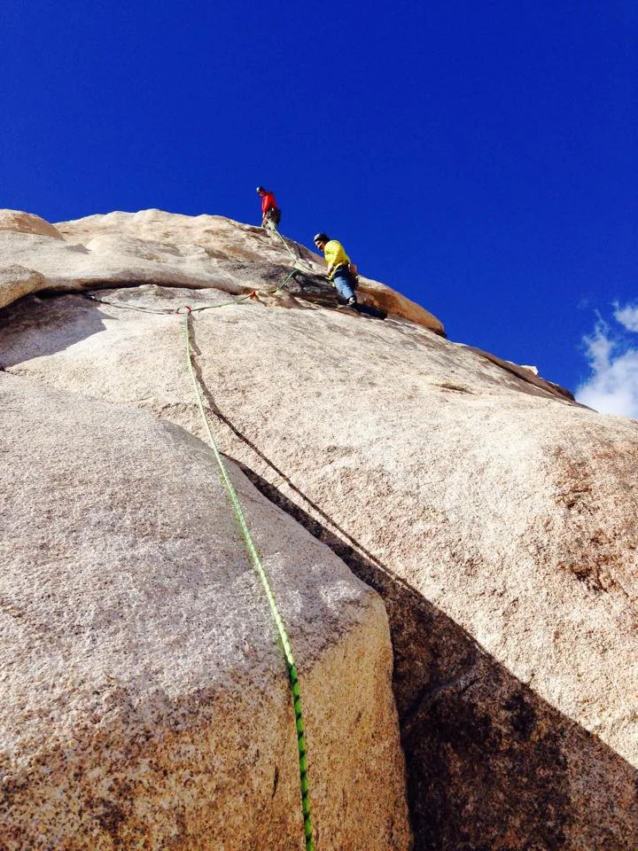 Chris belaying Michael up Toe Jam.