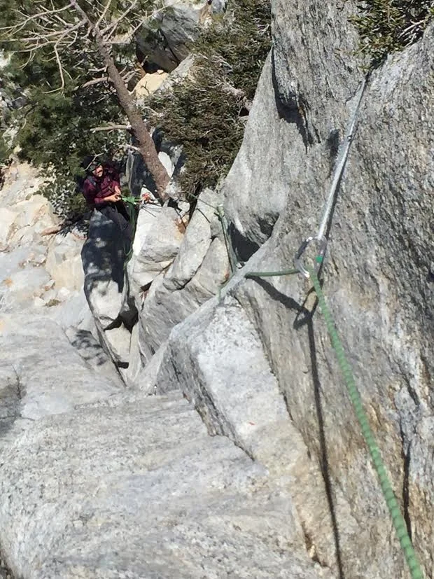 Me belaying at our first belay station at the tree.