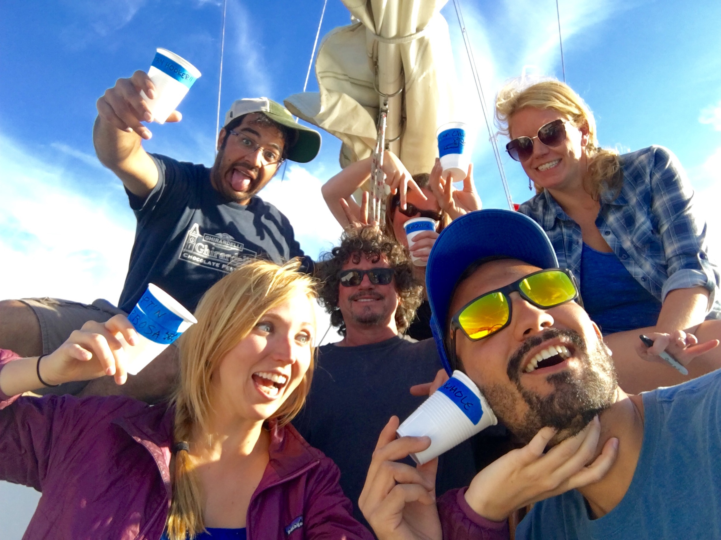 The crew with our drink cups with our pirate names on them.