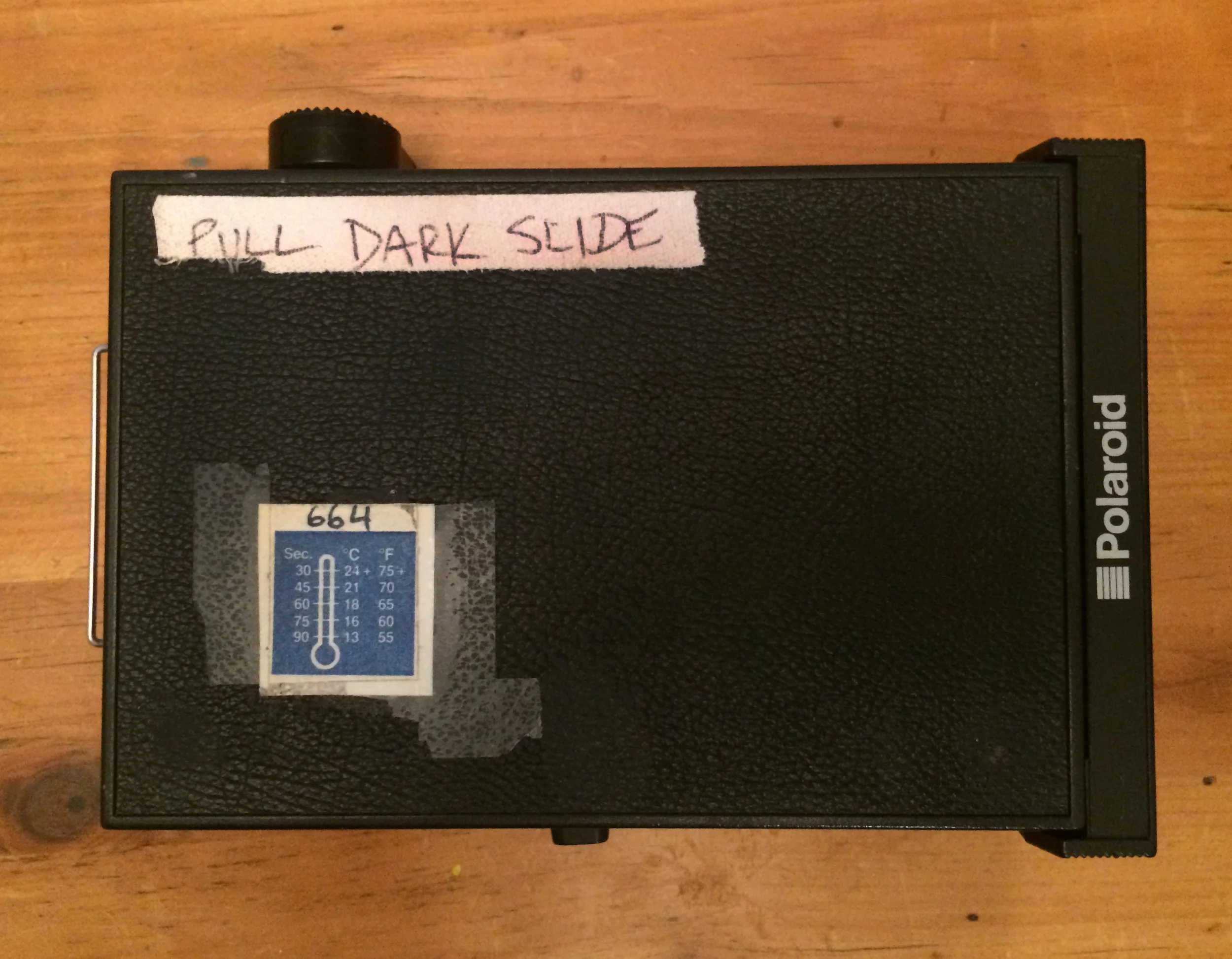 Polaroid back We used to forget to pull the dark slide!!