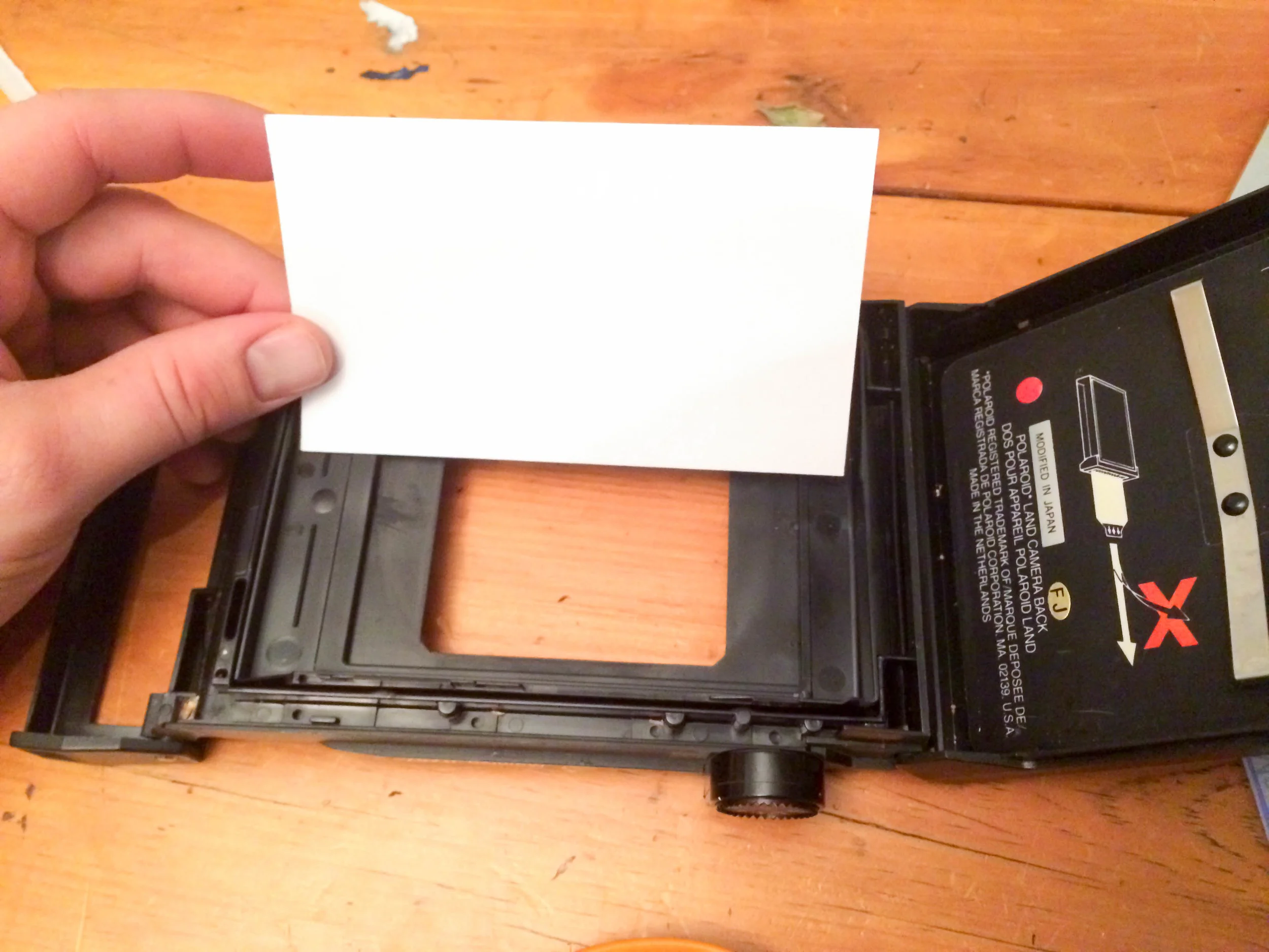 We used a piece of paper to measure and create a temporary template. This will also come in handy prior to cutting your plate and gluing your lexan strips in place. 