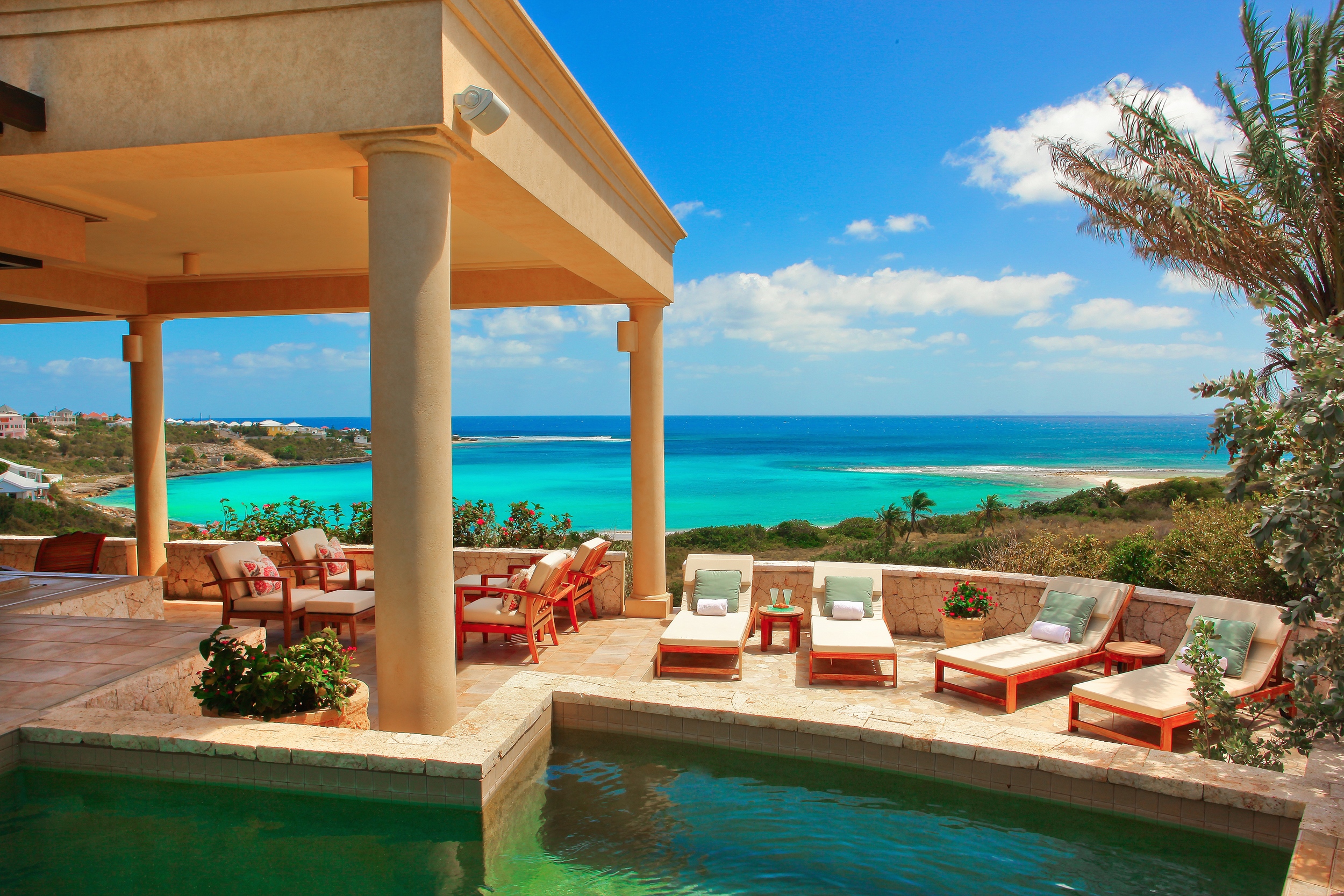 View of Sandy Hill Beach and exterior of Bird of Paradise luxury villa for rent on Anguilla island
