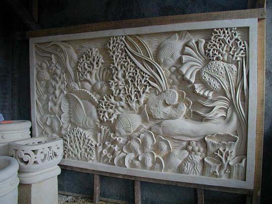  Underwater marine scene carved for a hallway. Planters to the left also hand-carved for the owners. Photo taken in Bali. 