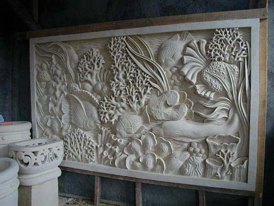 Underwater marine scene carved for a hallway. Planters to the left also hand-carved for the owners. Photo taken in Bali.