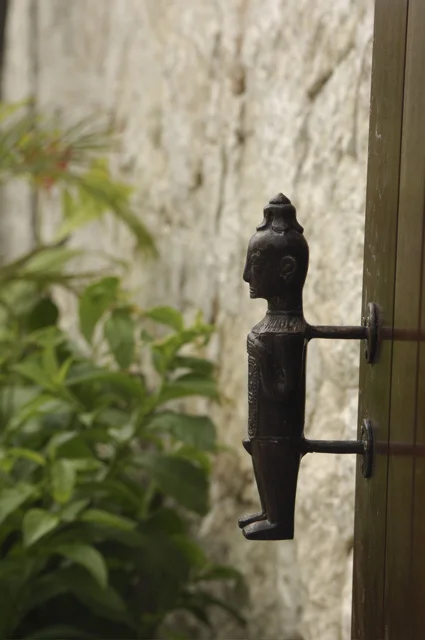 Bronze door pull in design of a Buddhist prince