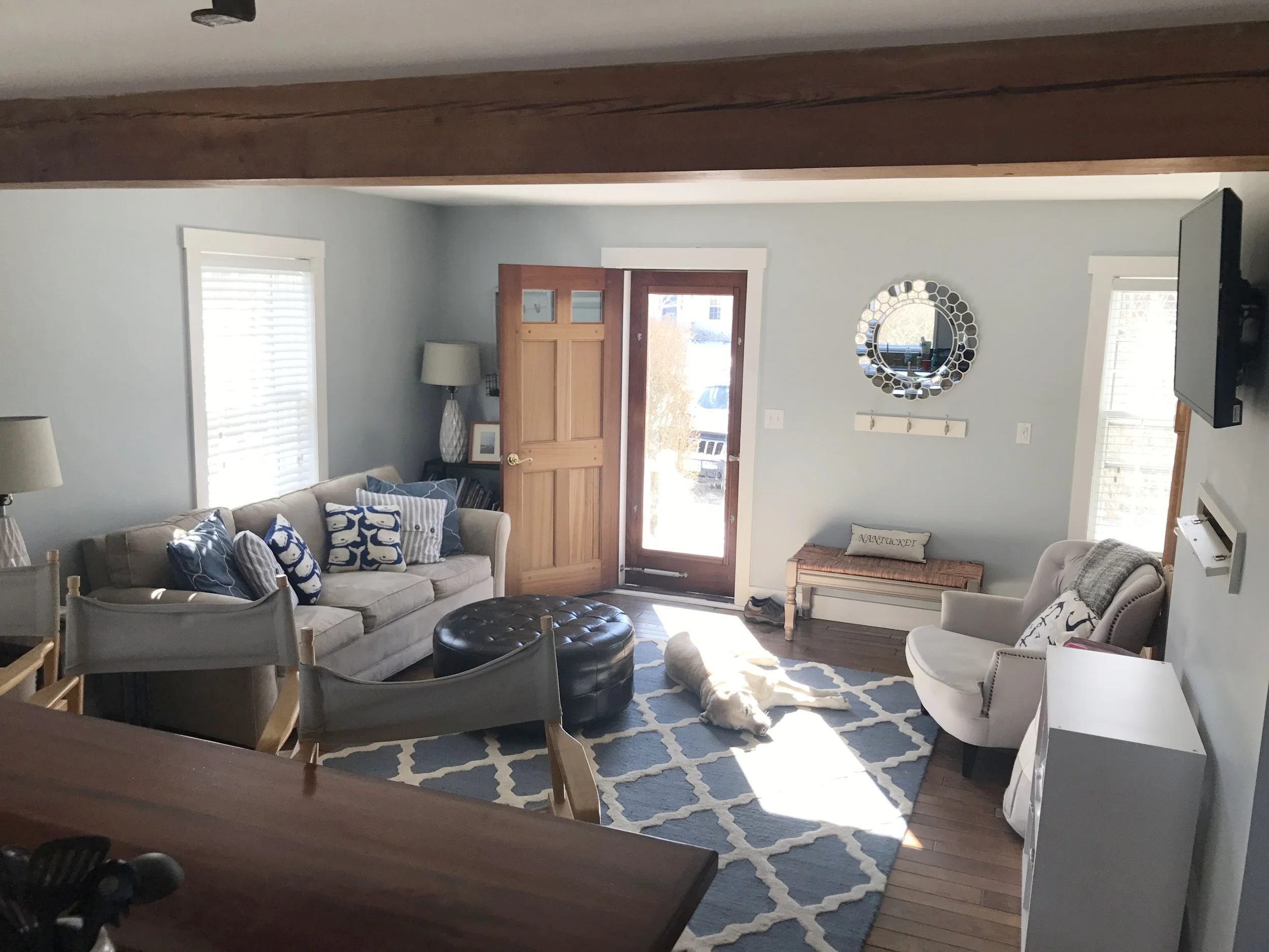 Bright living room with mounted wall TV