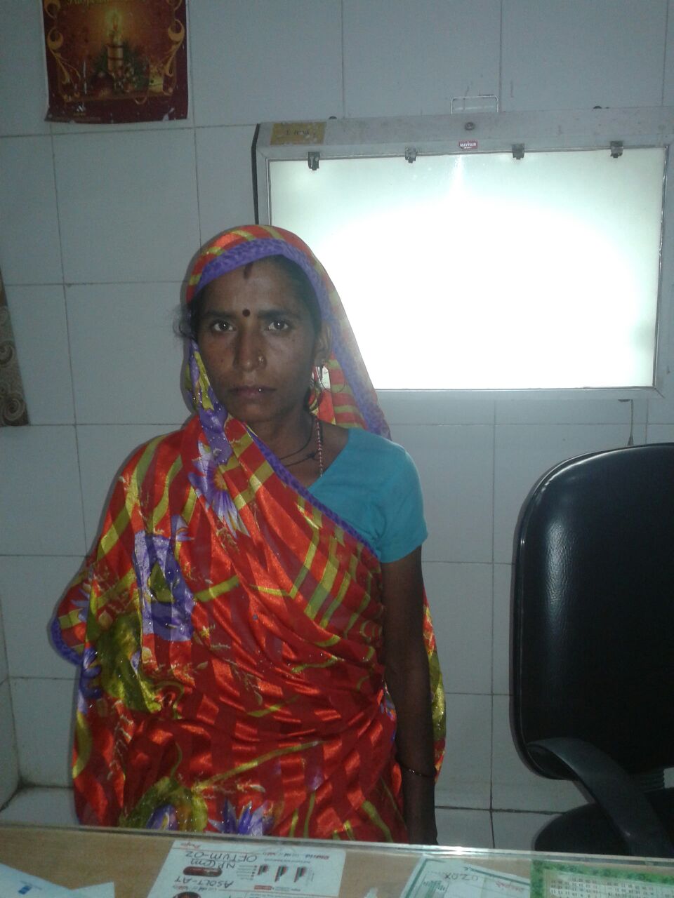 Roshni has a urinary tract infection. Her husband is a laborer who works in Southern India, where he can find more work. She receives the money he sends and tells us she misses him very much. 
