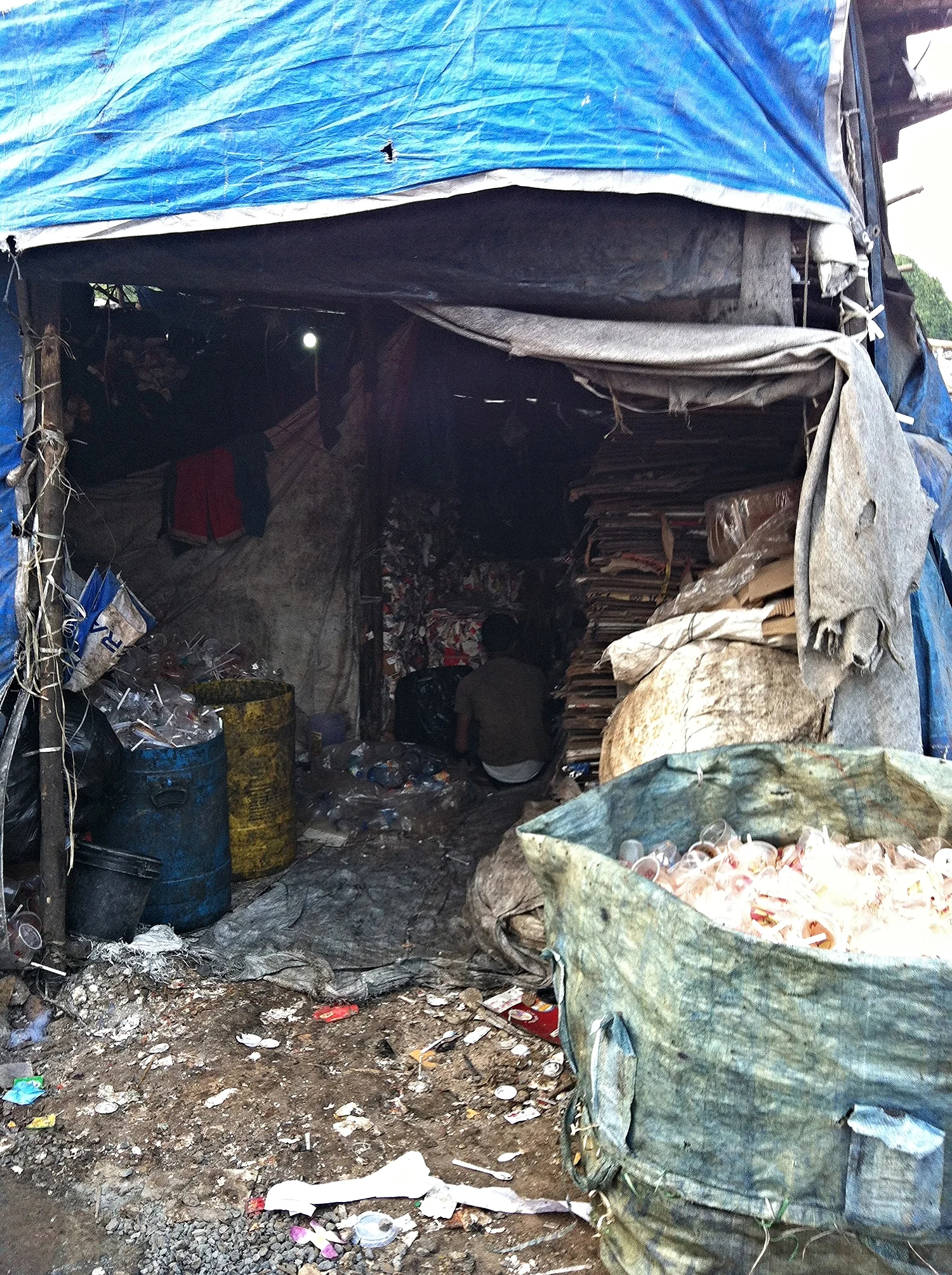 Edi often played in this trash dump in his slum. We spoke with Edi about hygiene after sponsoring antibiotics for his stomach infection.