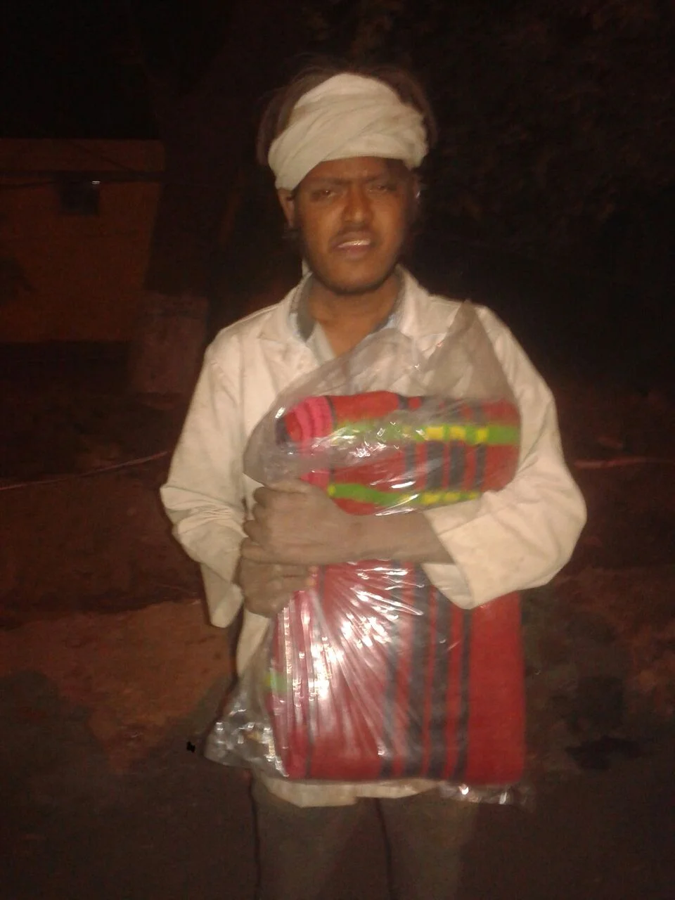 This is Kumar. He says he is around 4o years old. He works as a laborer and sleeps outside the construction site.