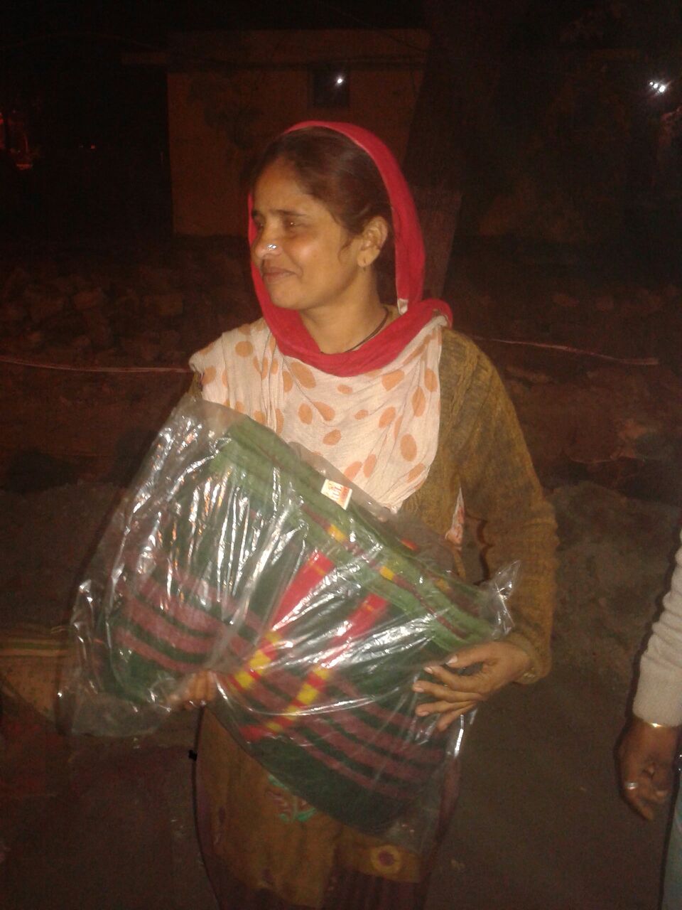 Meet Tanya. She is smiling in this picture because she had been wanting another blanket for her son, who is 6 years old.