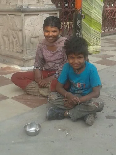 These two boys cook and clean for a family like Shankar did when he was a child.&nbsp;