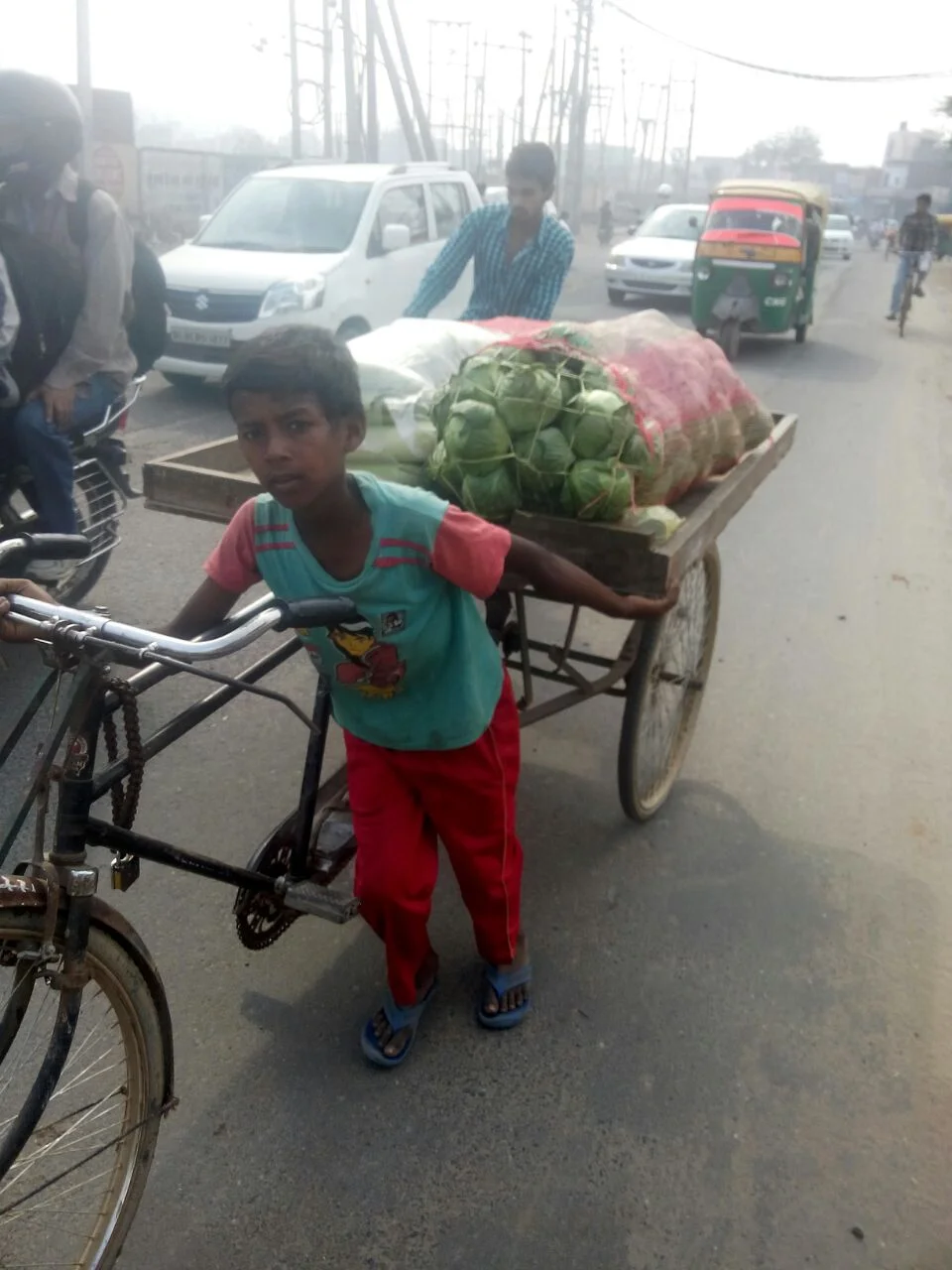 This boy was sold to a farmer. He picks crops and helps sell them, working up to 12 hours a day. 