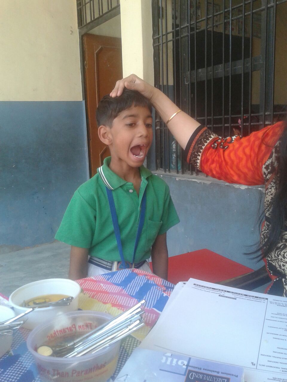 Rajesh is 7 years old. He loved playing with our dentist's instruments. 