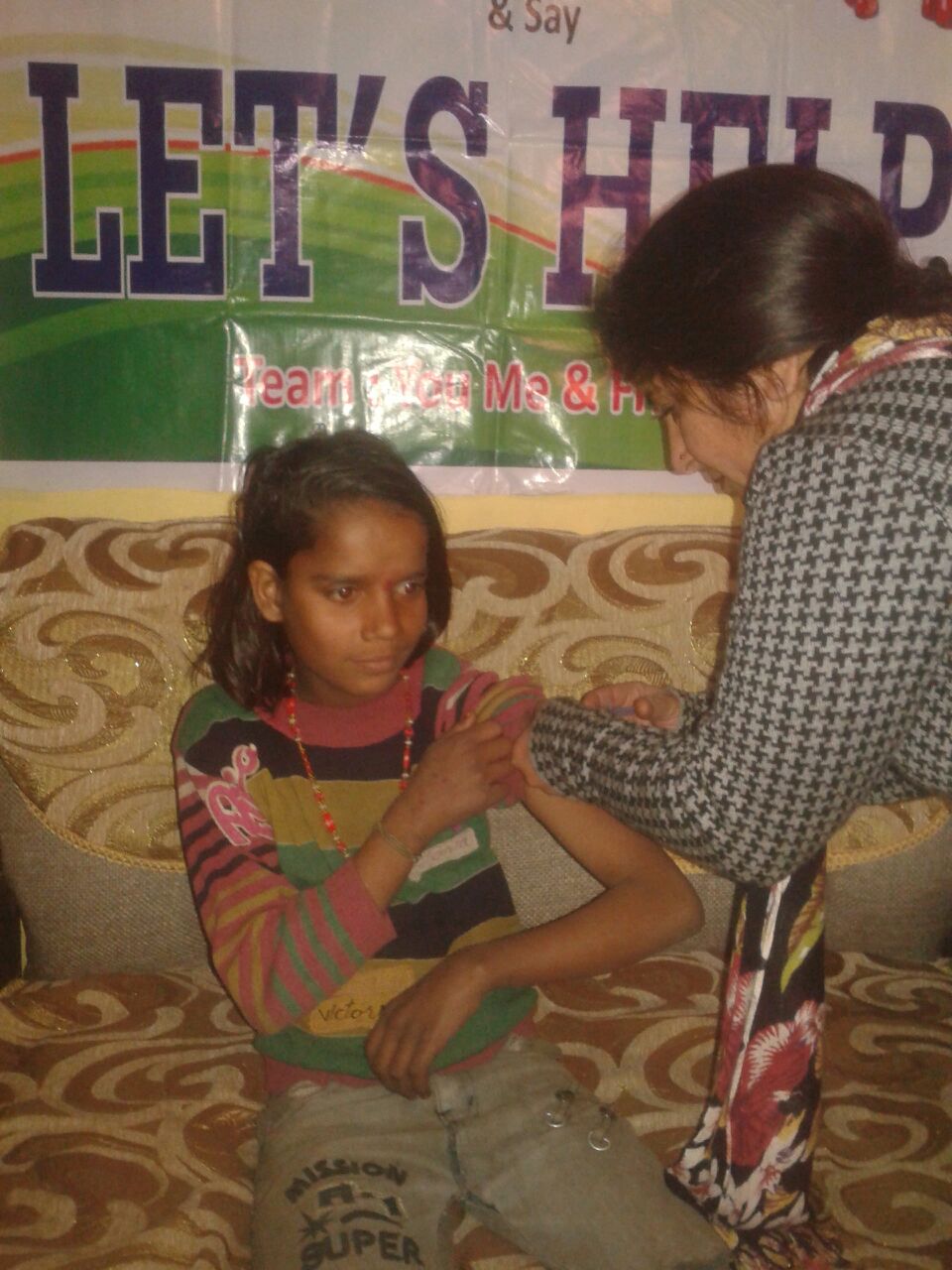 Indu is 9 years old and had never received an injection before. Our pediatrician (pictured to the right) reassured and comforted her.