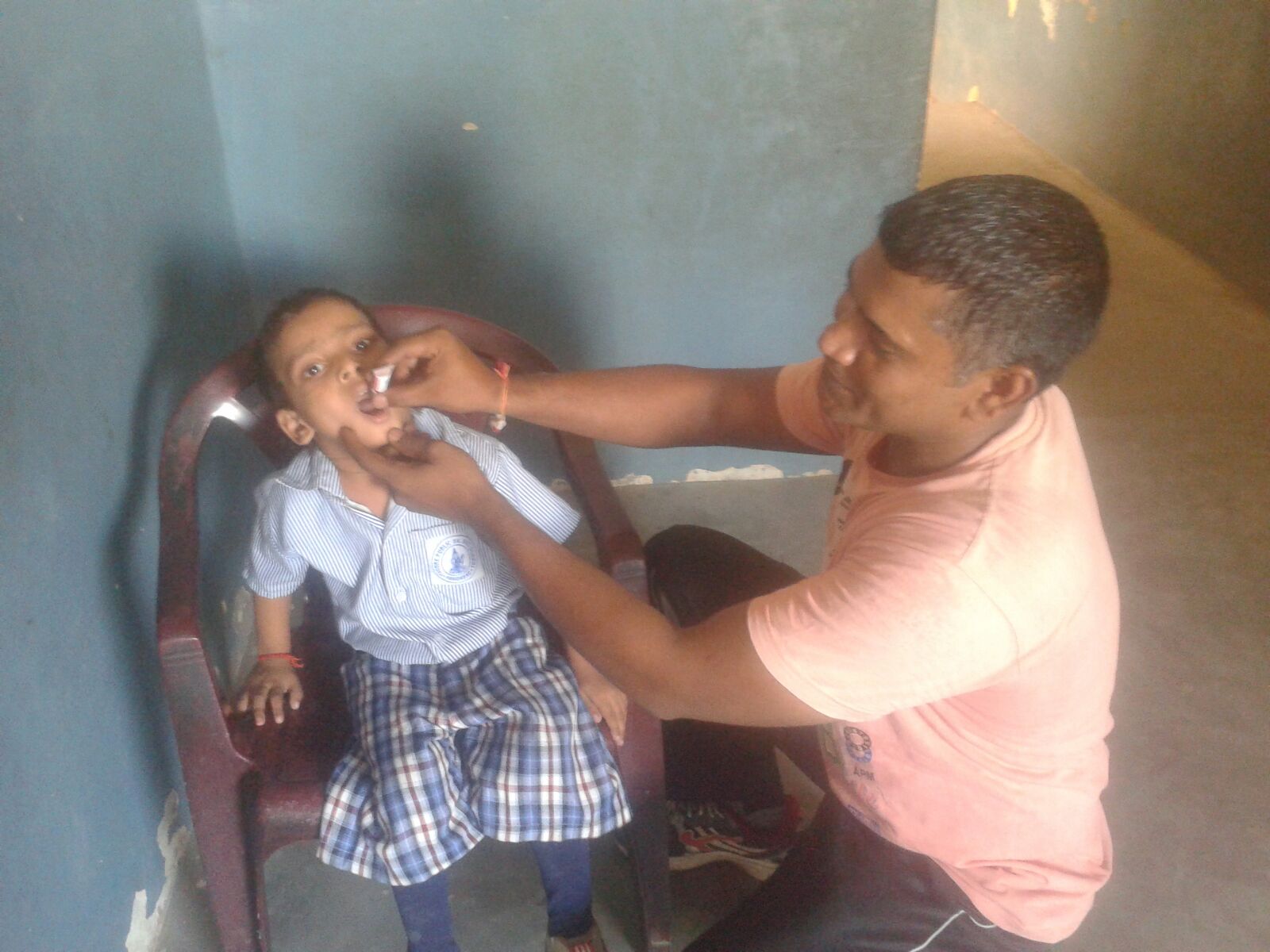 Gita is receiving oral vaccines. She is undernourished and requires nutritional supplements. She wants to be a doctor when she grows up.