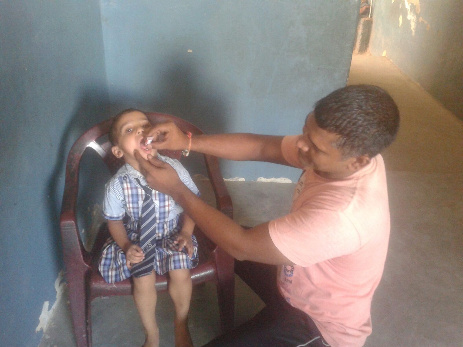 Meet Simi. He is 5 years old and wants to be a teacher when he grows up. He is receiving oral vaccines in this photo.