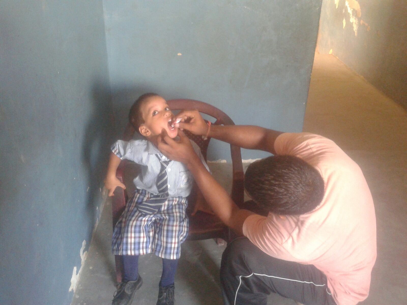 Utsef is 4 years old. He is receiving oral vaccines in this picture. He suffers from malnutrition and requires nutritional supplments. 