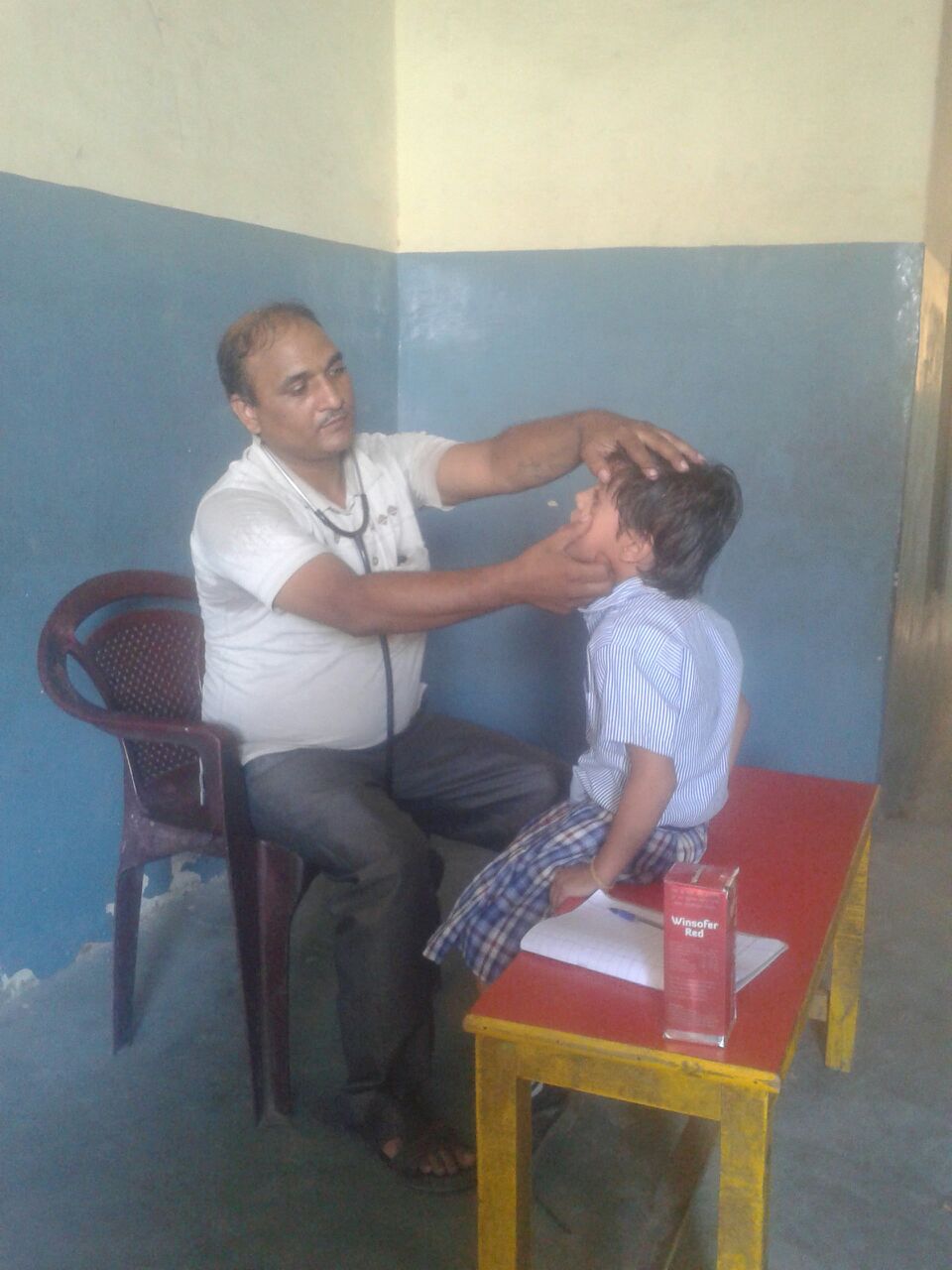 Meet Bisaj, who is 6 years old and lives in the local slum. Our volunteer pediatrician is examining his eyes for signs of eye infections or neurological deficits. 