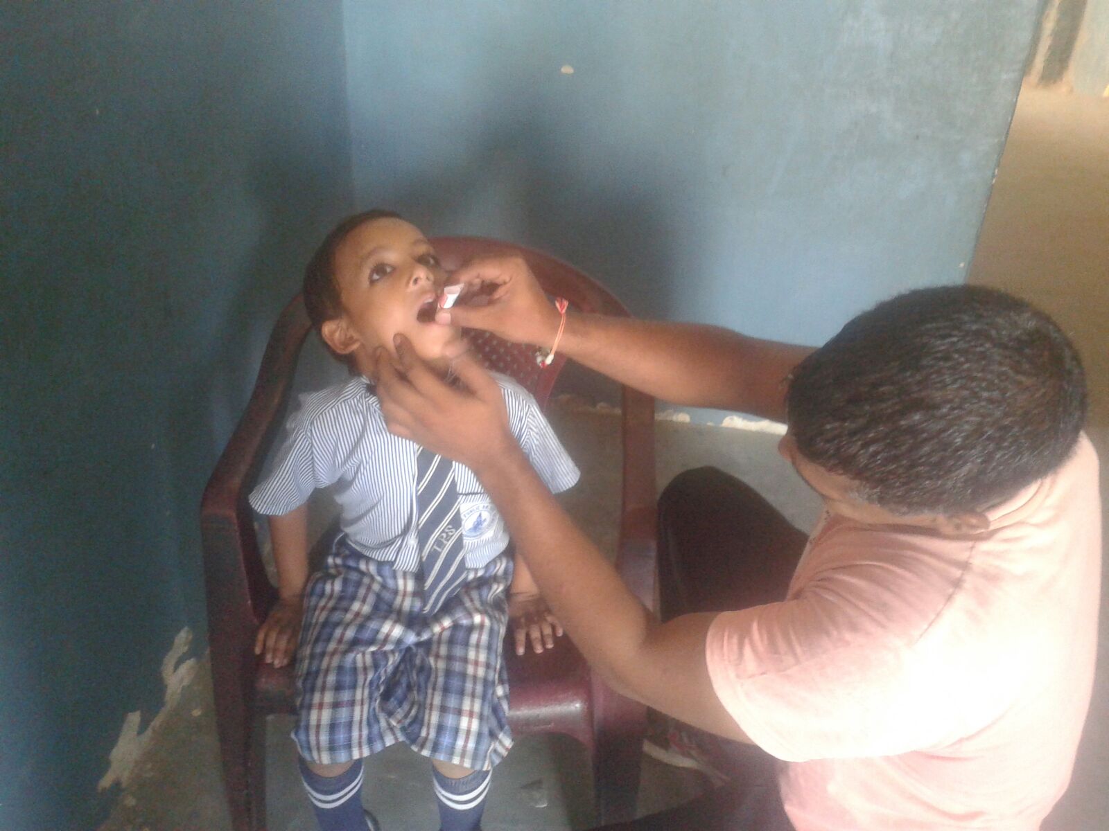 This is Rajiv. He is being given oral vaccines.