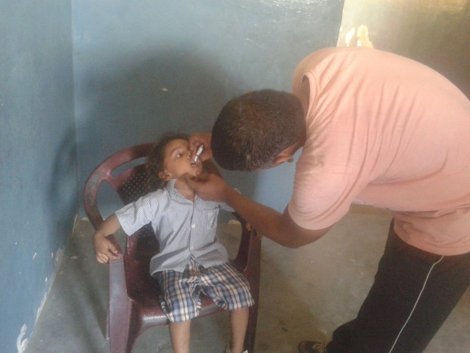 This is Yash. He is 5 years old. He is receiving oral vaccines in this picture. 