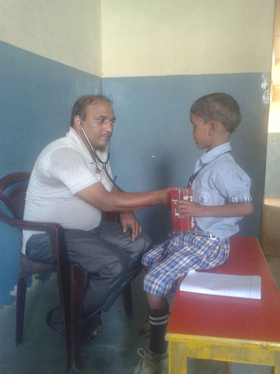 This is Manoj, a 6 year old boy. His malnourished. He is holding a case of protein powder in this picture. He requires more nutritional supplements. 