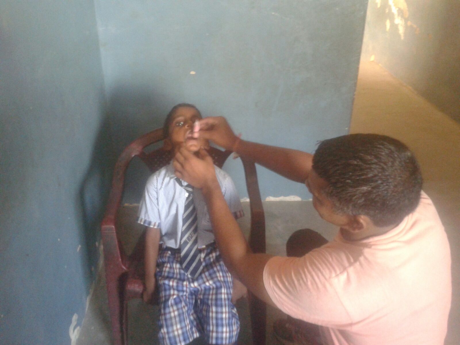 Meet Rishi. He is receiving oral vaccines in this picture. 